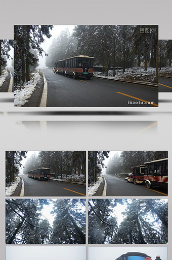 4K实拍冬季在雪景公路上行驶的小火车图片
