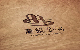 木纹桌面上的雕刻立体logo样机