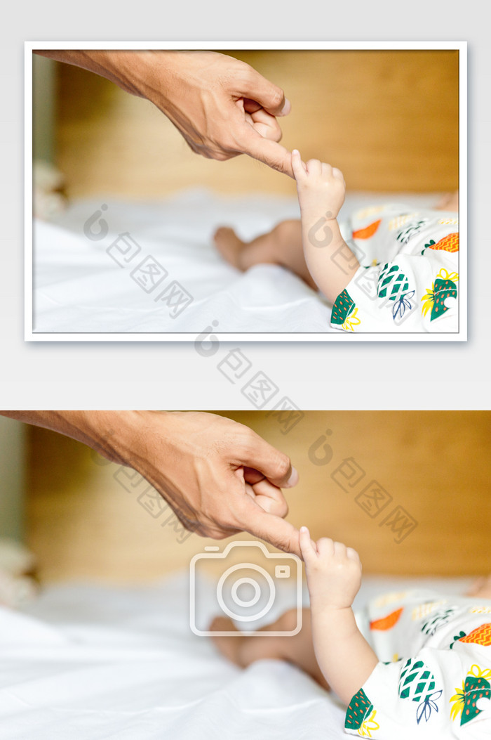 婴儿抓住爸爸的手图片图片