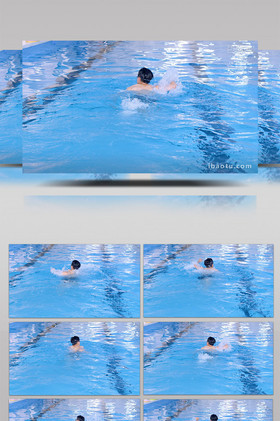 在泳池里游泳的男子背影实拍