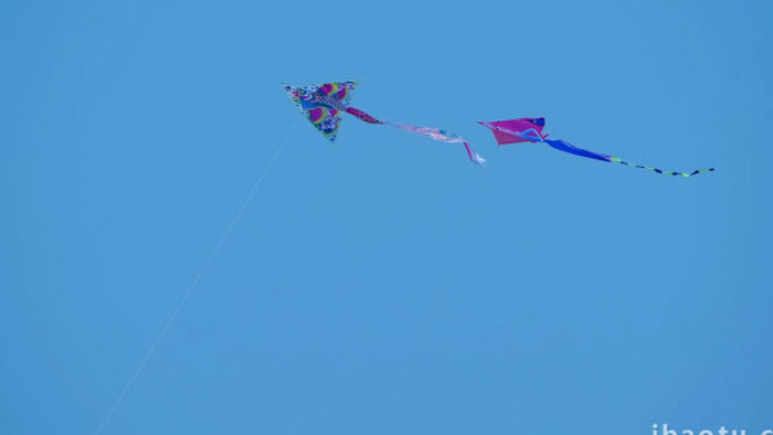 天空中的风筝纸鸢飞翔亲子活动特写实拍素材