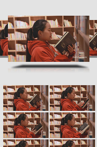 人物形象女孩在图书馆拿书阅读图片