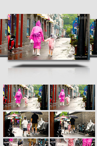 父母牵手孩子雨中漫步空镜实拍图片