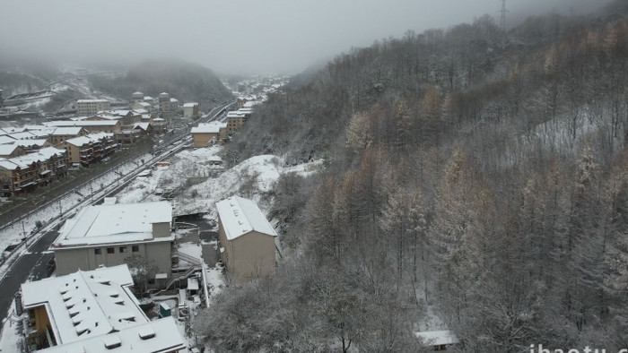 美丽乡村古镇冬季下雪雪景航拍