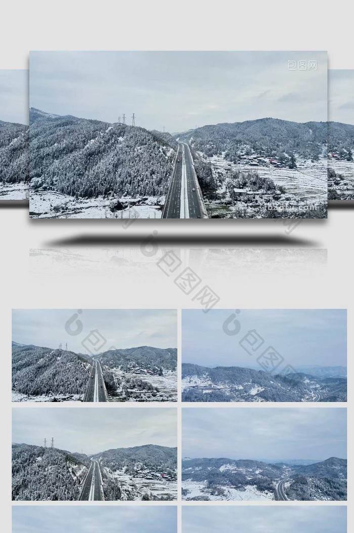 冬季雪景大山中的高速公路航拍