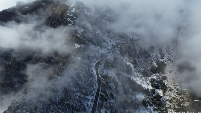 冬季雪景山峰山顶公路自然航拍