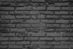 老样式石头墙壁背景。黑砖墙抽象。粗糙坚实的纹理和粗糙的表面背景的建筑材料装饰或复古室内房间的概念.
