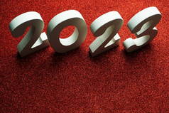 2023新年快乐，带有红色闪光背景的太空复制品