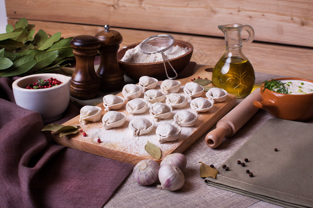 dumplings rural village board bay leaf still-life plank wood flour ingredients appetizing nourishing