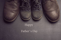 爸爸的靴子和婴儿鞋, 父亲节概念.