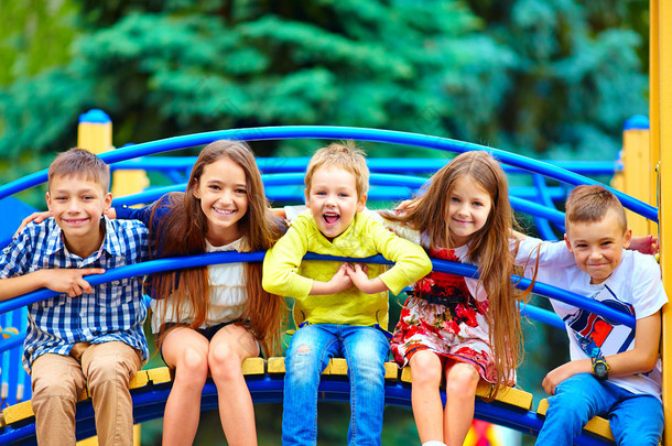 group of happy kids having fun on playground