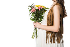 裁剪视图怀孕的波霍妇女拿着鲜花孤立在白色