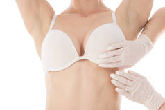 乳腺科医生在乳胶手套检查病人在白色分离的部分视图