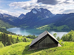 Traditional architecture and farmhouse in the valley of Wagital or Waegital and by the alpine Lake W