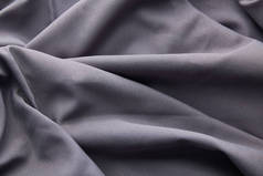 灰色折皱纹理布的背景