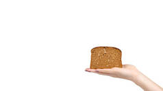Hand with slice of brown bread with seeds, heathy food. Isolated on white background. Copy space, te