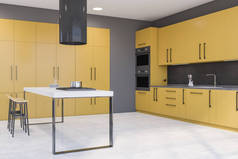现代化厨房的角落，有灰色的墙壁，混凝土地面，黄色的橱柜，两个烤箱和带有凳子的酒吧。3d渲染