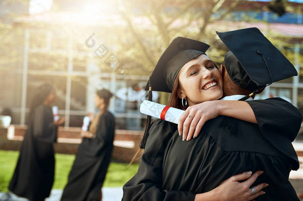 Your support means the world to me. a happy young man and woman hugging on graduation day