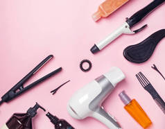 头发造型和护理项目和产品在粉红色的背景