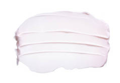 柔和粉红色的笔触和面部奶油或丙烯酸涂料的纹理隔离在白色背景上