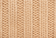 浅棕色和黄色针织的羊毛宏照片，纹理背景