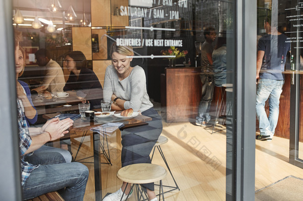 Woman enjoying coffee break with friends