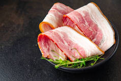 bacon strips meat slice thin slicing pork fat healthy meal diet snack on the table copy space food b