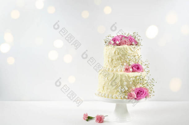 Wedding or Birthday 2 Tiered Cake with Bokeh Party Lights.
