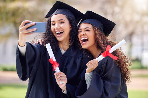 What feels like the end is really just the beginning. two young women taking a selfie on graduation 