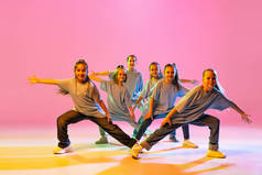 Hip-hop dance, street style. Happy children, little active girls in casual style clothes dancing iso