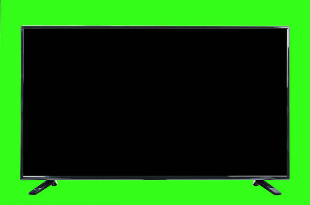 现代高清电视。 Lcd平面监视器与空白黑色屏幕,隔离在抽象模糊的绿色铬色背景. 科技与4k电视广告概念。 详细的工作室特写