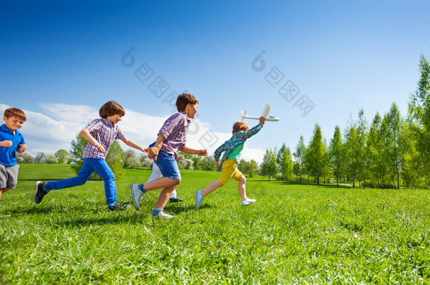 happy running kids with airplane toy