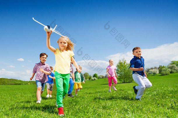 happy running kids with airplane toy