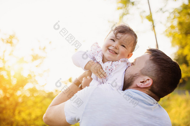 Happy father with his daughter having fun