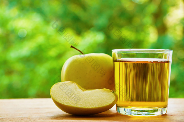 Apple, lobule and glass on the table