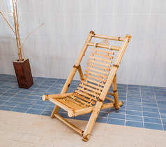 amazing beautiful stylish natural bamboo chair standing on blue and biege  ceramic floor