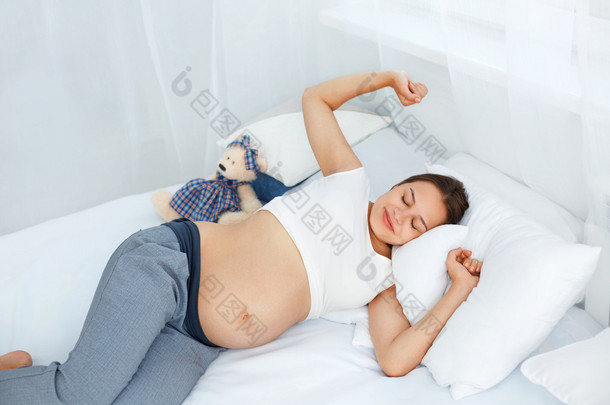 Pregnant Woman waking up in the Morning. Mom Expecting Baby. Bea