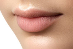 Close-up of woman's lips with fashion natural beige lipstick makeup. Perfect Lips. Sexy Girl Mouth c