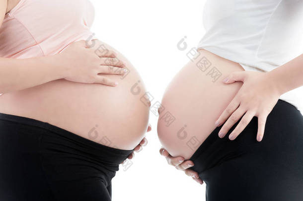 两个孤立的白色背景上的怀孕妇女的肚子