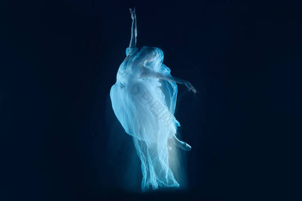 这张照片是<strong>艺术</strong>-美丽的芭蕾舞演员，从幔子经过在深色背景上<strong>感</strong>性和情<strong>感</strong>的舞蹈。频闪的形象的一个模型