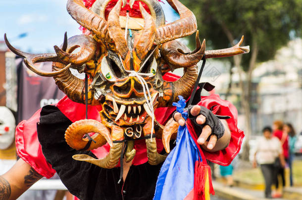 Quito, Ecuador - September, 03, 2018: Portrait of unidentified man dressed up and participating in t