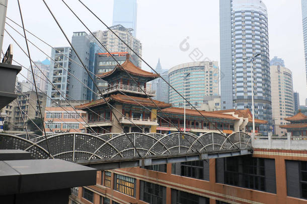 View of one of the two 68.5-meter-<strong>high</strong> suspended bridges connecting two <strong>high</strong>-rise buildings in Chong