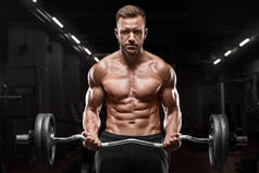 肌肉发达的男子在健身房锻炼为二头肌, 强壮男性裸躯干 abs