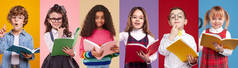 穿着五颜六色衣服的现代聪明的多种族儿童在阅读五颜六色背景的教科书时看着相机