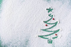 圣诞树涂上了面粉绿色的背景和地方用小玩具书写文字。从上面看.