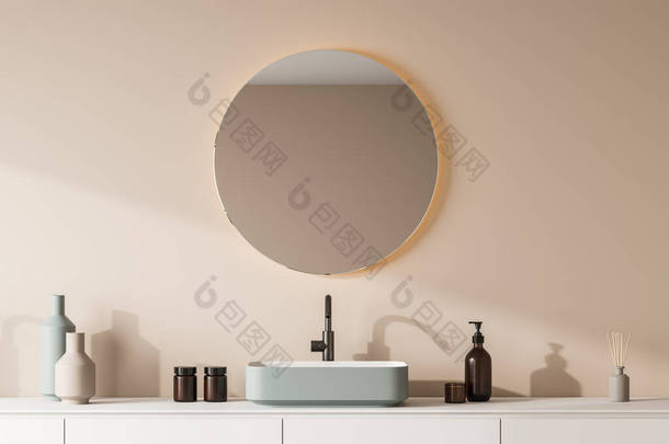 时尚的绿色水槽，一个虚荣，有抽屉和圆形的镜子与照明米色墙壁的浴室内部。现代室内设计的概念。3d渲染