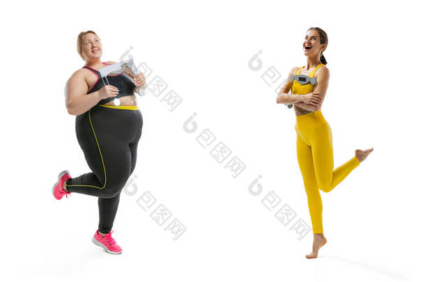 Happy young slim girl and plus-size woman wearing sport uniform isolated on white background. Concep