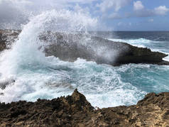 waves breaking in cliffs, rocky coast and ocean. beautiful beach. Boka table. Curacao