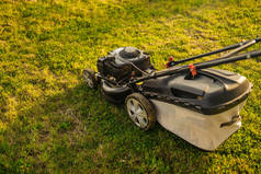 Close up view of grass mower and worker