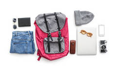 Accessories for travelling with mobile phone and laptop on white background
